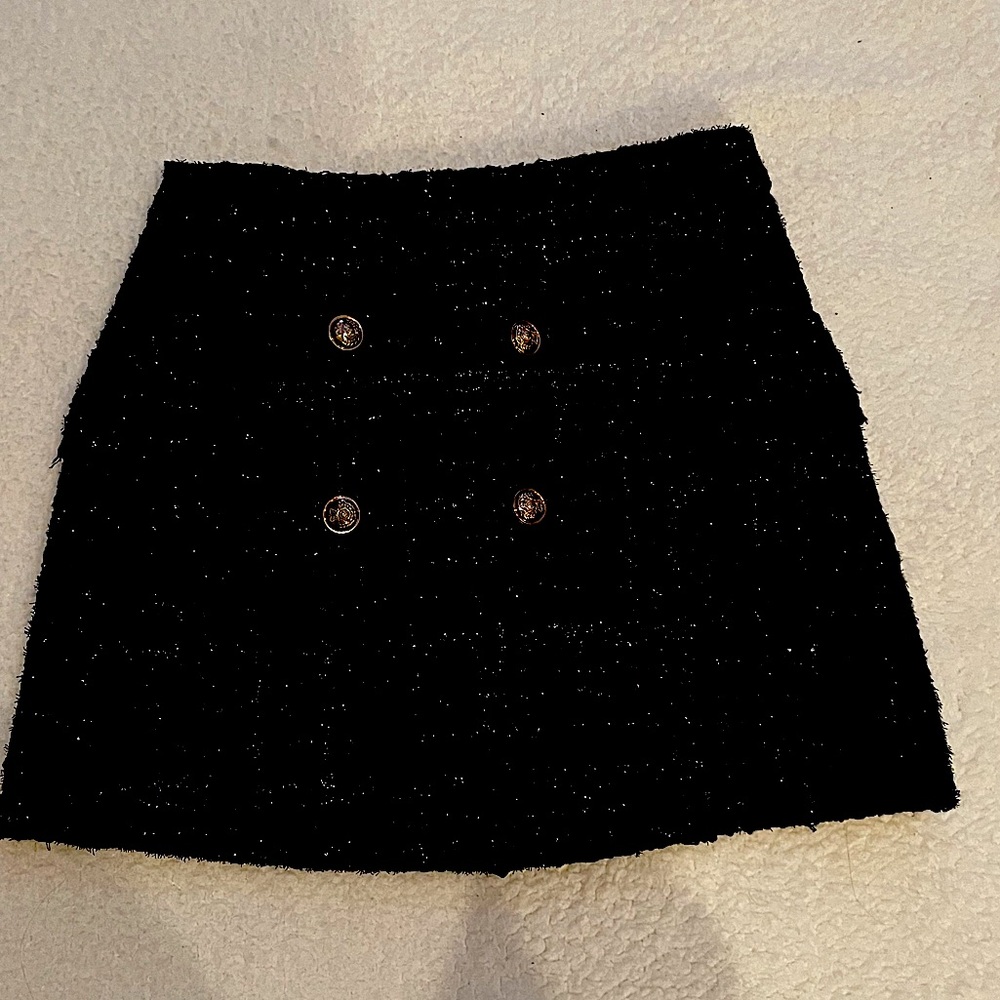 Black nubby skirt with checked metallic thread.